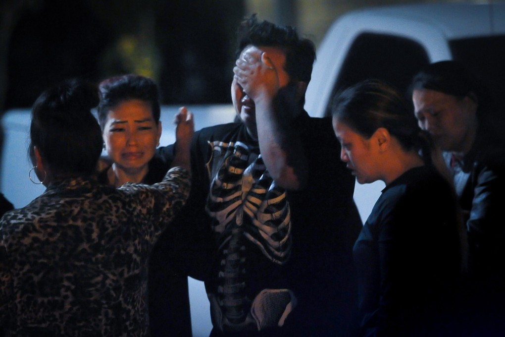 People gather late on Sunday near the site of a fatal shooting in Fresno, California. Photo: Fresno Bee via TNS