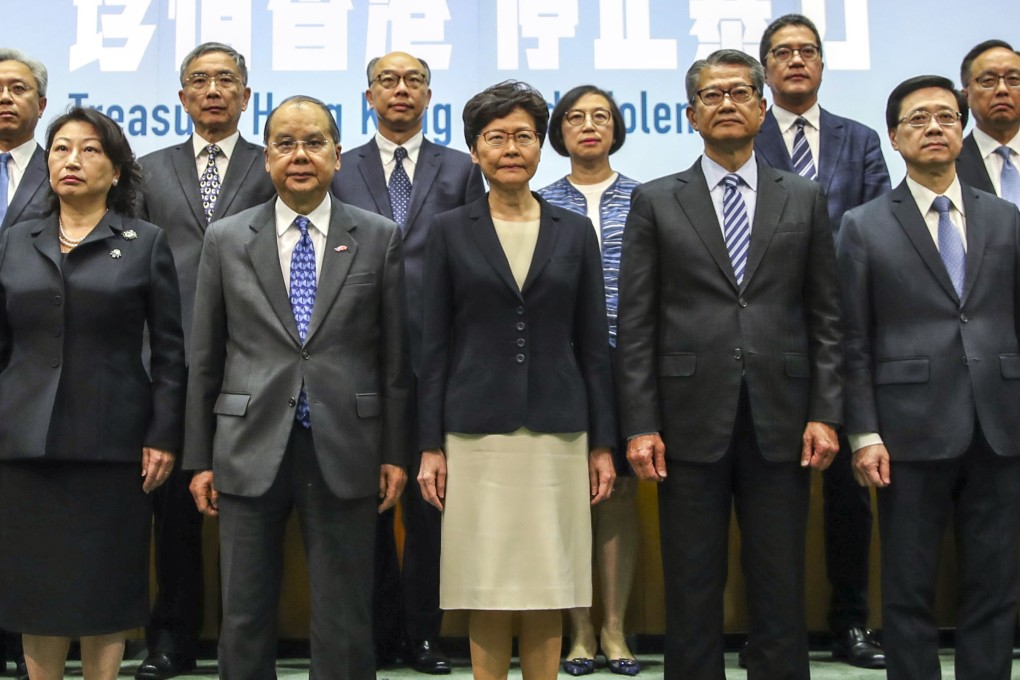 Chief Executive Carrie Lam (centre) and her team in government, including Chief Secretary Matthew Cheung (second from left) and Justice Secretary Teresa Cheng (left), attend a press conference at the government headquarters in Admiralty on October 4. Photo: Winson Wong