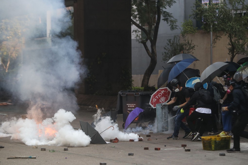 The air is thick with tear gas on Gascoigne Road near Queen Elizabeth Hospital. Photo: Winson Wong