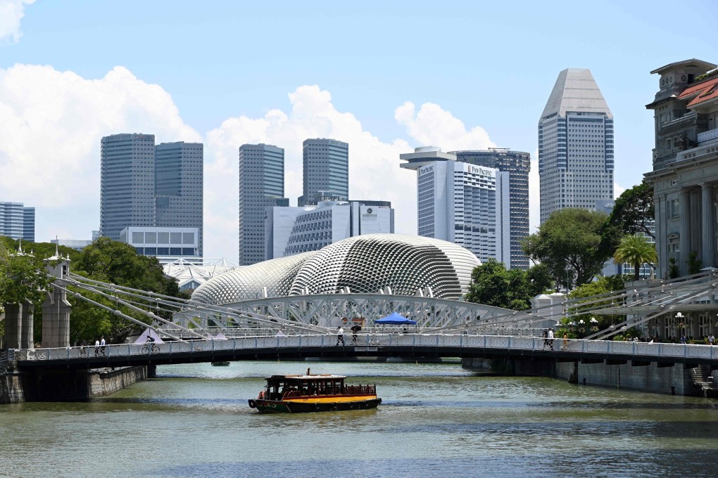 A tour boat plies along the Singapore River. A couple who ran two clubs on Boat Quay was convicted in Singapore’s first labour trafficking case. Photo: AFP