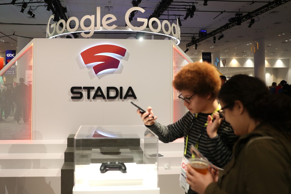 Attendees look at the new Stadia controller on display at the Google booth at the 2019 GDC Game Developers Conference on March 20, 2019 in San Francisco, California. Photo: AFP