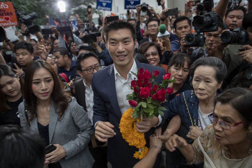 Thanathorn Juangroongruangkit surrounded by supporters on his arrival at the Constitutional Court on November 20, 2019. Photo: AP