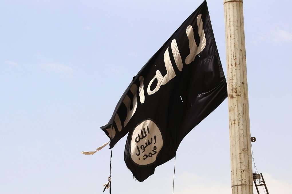 An Islamic State group flag seen in the Syrian town of Tabqa on April 30, 2017. File photo: AFP