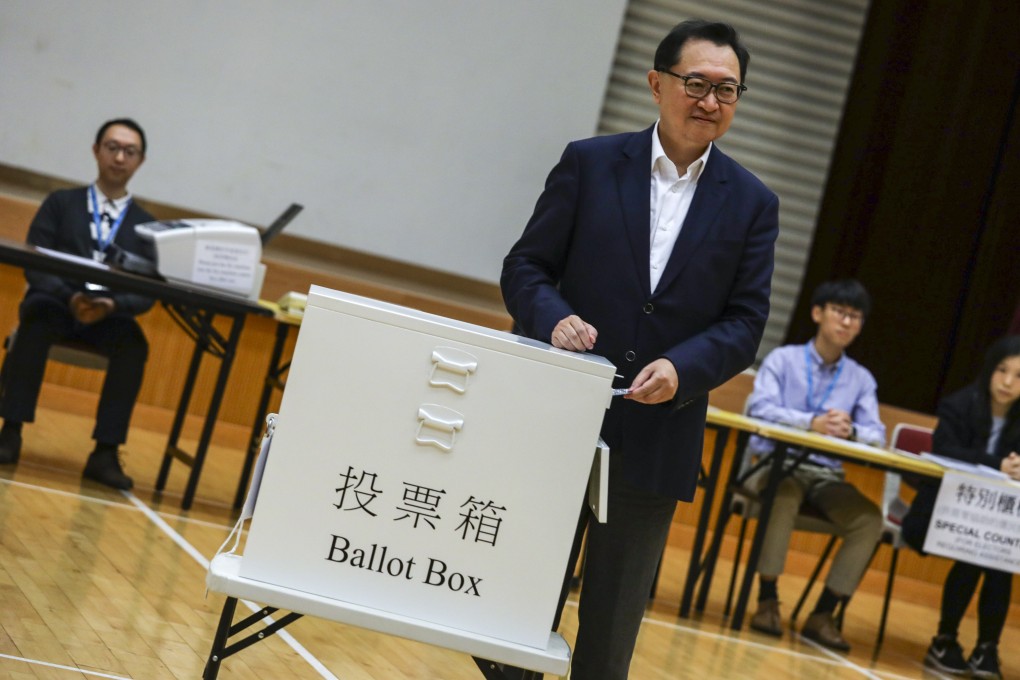 Electoral Affairs Commission chairman and High Court judge Barnabas Fung Wah demonstrates the voting procedure at a mock polling station at Leighton Hill Community Hall, in Happy Valley, on Tuesday. Photo: May Tse