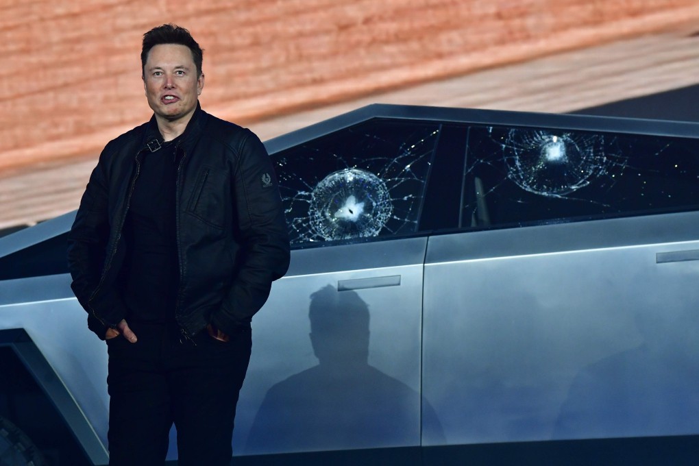 Tesla chief executive Elon Musk stands in front of the shattered windows of the newly unveiled Cybertruck, an electric battery-powered pickup truck, at the Tesla Design Centre in Hawthorne, California on November 21. Photo: Agence France-Presse