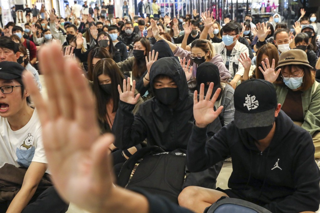 Protesters gather in Yoho Mall to mark four months since an attack at the nearby Yuen Long MTR station. Photo: K.Y. Cheng