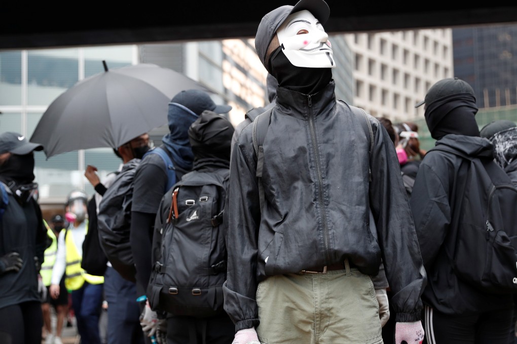A demonstrator wears a face mask during an anti-government protest in Central, despite a government ban on masks during protests. Photo: Reuters
