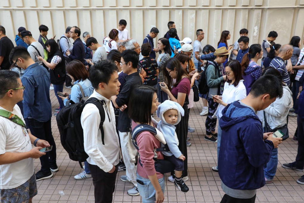 Large queues formed outside the polling station at Aberdeen Sports Centre as voters turned out early for the district council elections. Photo: May Tse