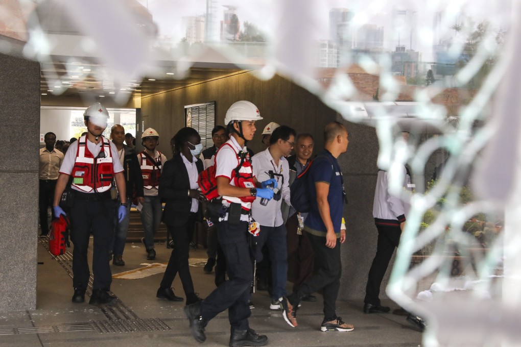 Yesterday, a 50-member PolyU group made up of management, security guards, councillors and Red Cross doctors entered the campus in search of anyone who might still be hiding there. Photo: K. Y. Cheng