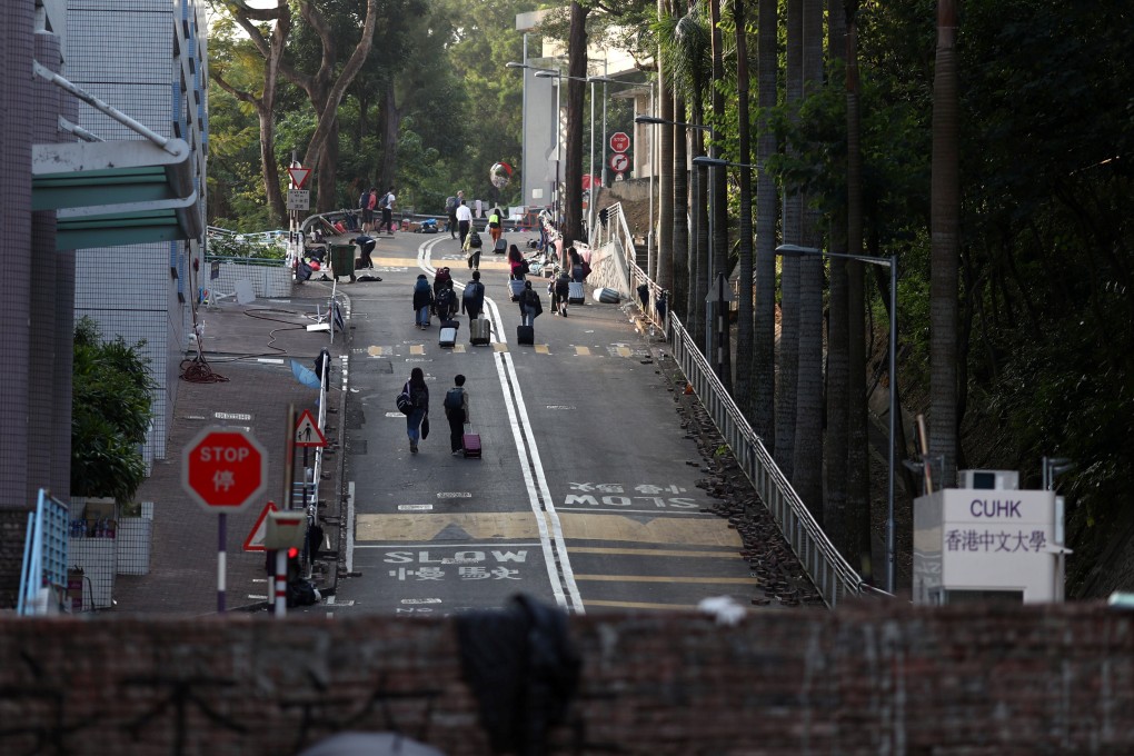 Students of Chinese University of Hong Kong evacuate the campus after it is occupied by anti-government protesters in this file photo from November 15. Photo: Reuters