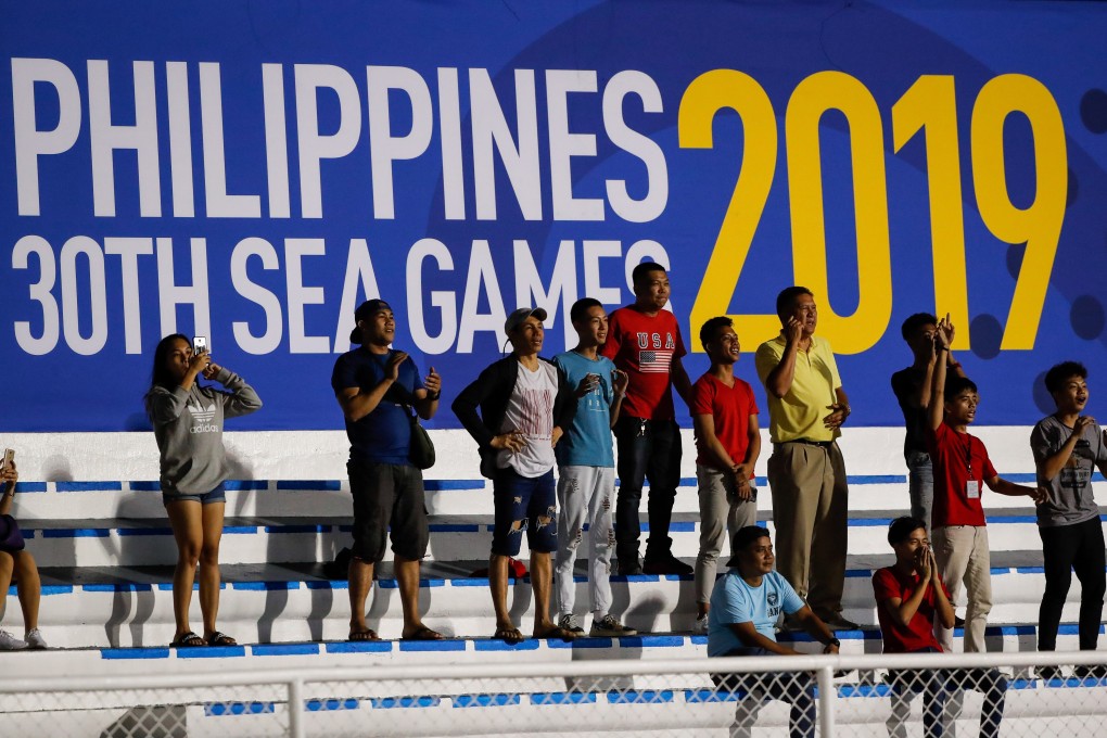Spectators watch the SEA Games football clash between Philippines and Cambodia in Manila. Photo: EPA