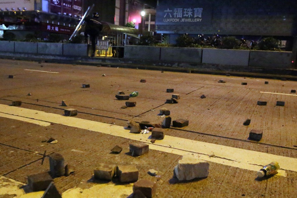 Bricks are seen on the pavement of Nathan Road in Mong Kok on February 9, 2016. Photo: Edward Wong
