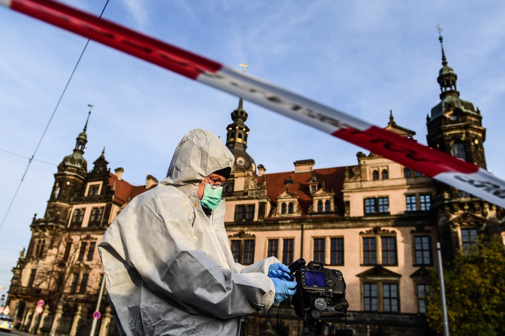 A police Forensics officer investigates the area near the Dresden Castle on Monday after the Green Vault was broken into. Photo: EPA-EFE