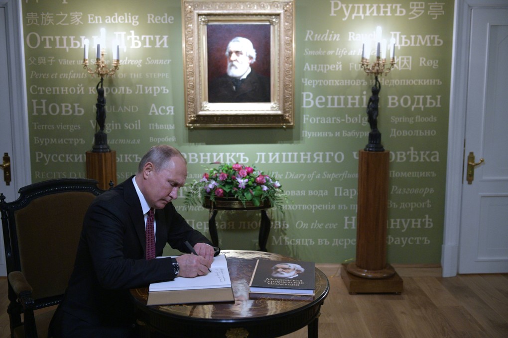 Russian President Vladimir Putin makes an entry in the Honoured Visitor Book as he visit the Ivan Turgenev Museum on Ostozhenka Street in Moscow on November 10, 2018. File photo: AFP