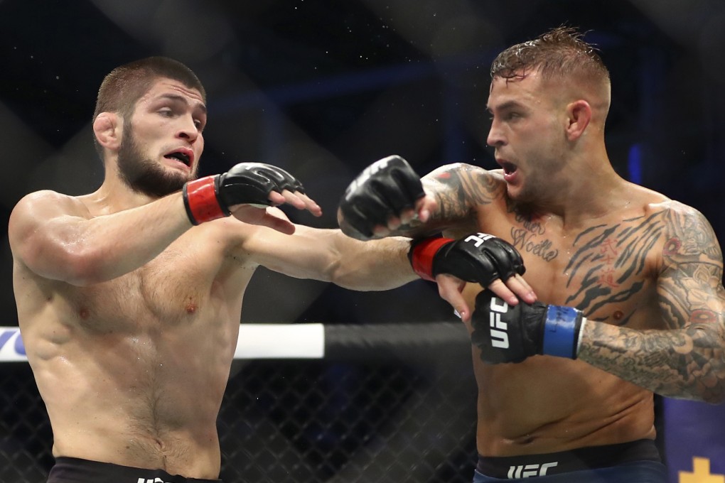 Dustin Poirier throws a punch at Khabib Nurmagomedov at UFC 242 in Abu Dhabi. Photo: AP