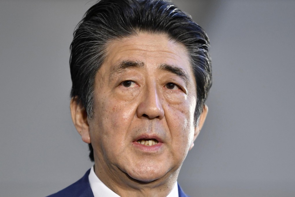 Japan’s Prime Minister Shinzo Abe staked a deflation-busting recovery on “Abenomics”, a three-arrowed strategy to promote sustainable growth through monetary, fiscal and structural policies that stimulated business investment and consumer spending. Photo: Kyodo