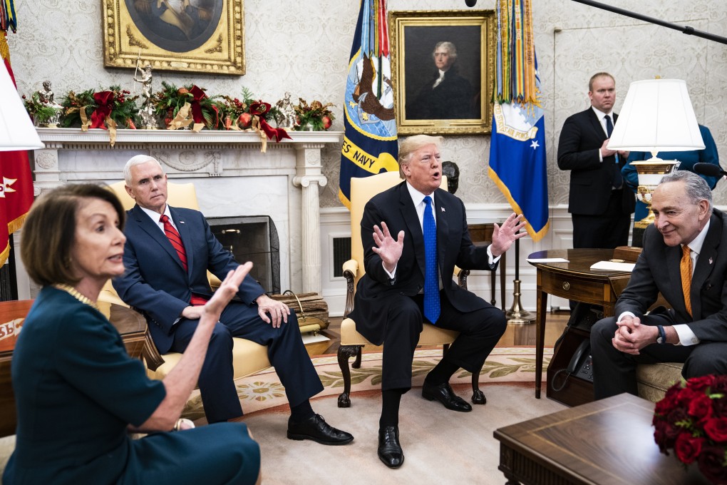 US President Donald Trump debates with House Minority Leader Nancy Pelosi and Senate Minority Leader Chuck Schumer as US Vice-President Mike Pence listens during a meeting in the Oval Office of the White House in Washington on December 11, 2018. The failure of negotiations between the Republican president and Democrats resulted in the longest US government shutdown in history. Photo: Washington Post