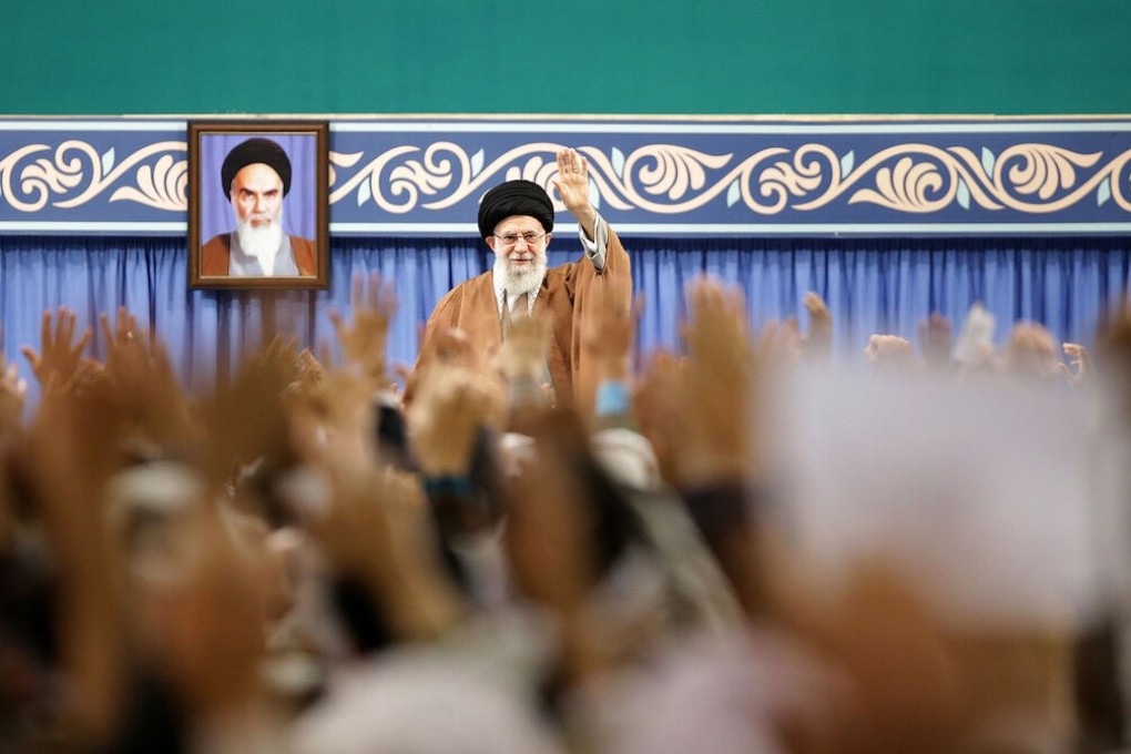 Iranian Supreme Leader Ayatollah Ali Khamenei waves during a meeting with members of the Basij force of the Islamic Revolutionary Guard Corps. Photo: DPA