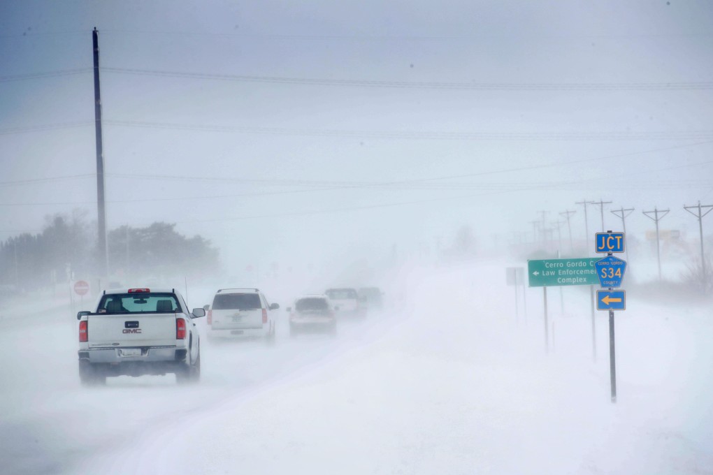 Motorists navigate an ice and snow-covered road in Mason City, Iowa, on Wednesday. Photo: AFP