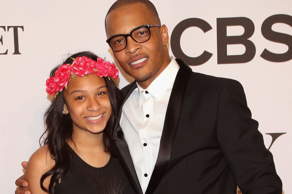 T.I. with his daughter Deyjah Harris. The US rapper has clarified his recent statements regarding policing her hymen and her virginity.