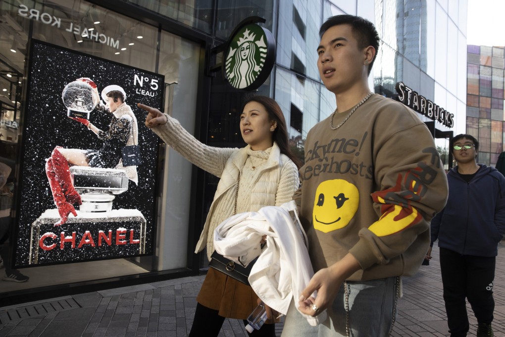 Shoppers visit a retail district in Beijing on November 10, ahead of Singles' Day. Photo: AP