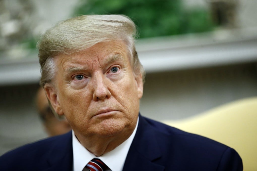 US President Donald Trump listens during a meeting in the Oval Office on Monday. Photo: AP