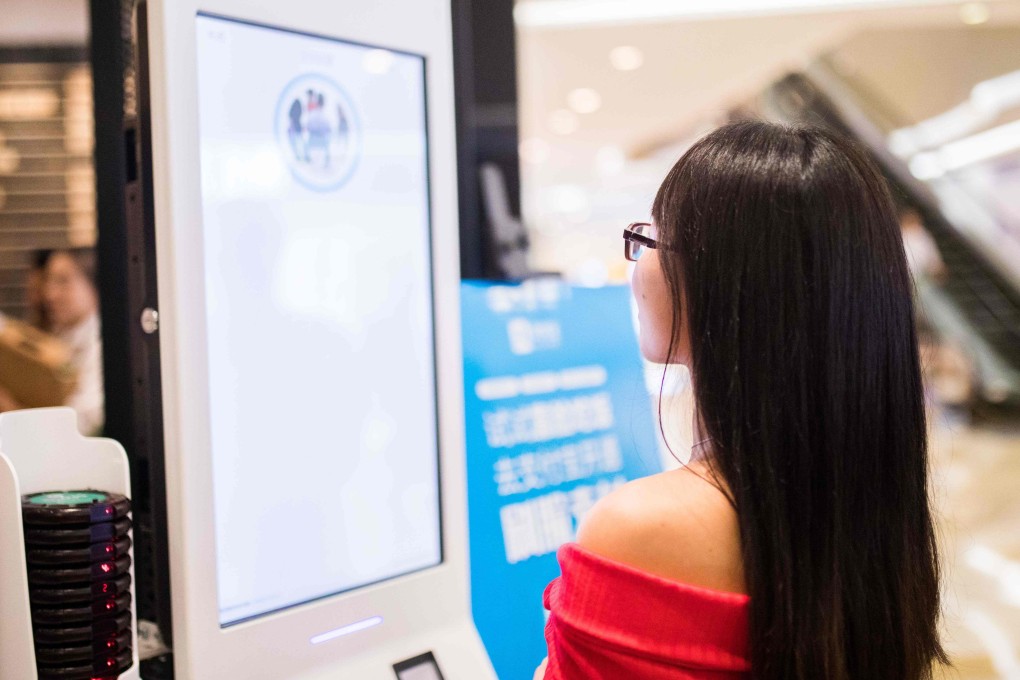 A customer uses a facial recognition payment system at a KFC fast food restaurant in Hangzhou, Zhejiang province. Photo: AFP