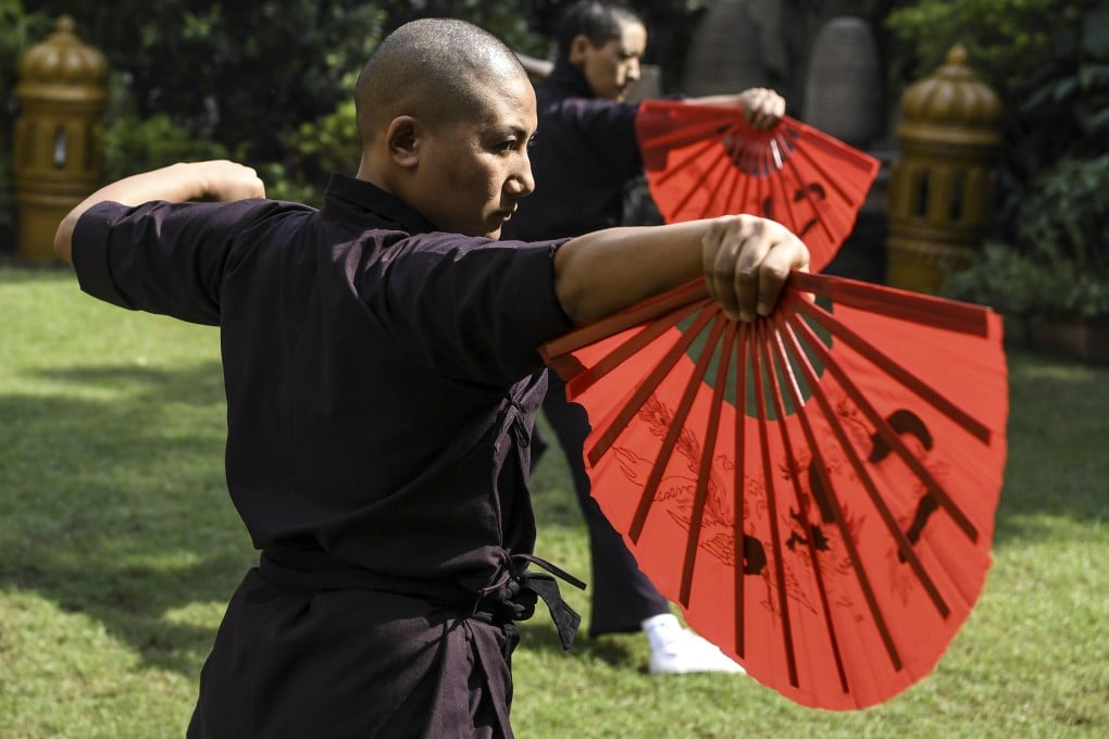 Members of the Kung Fu Nuns group demonstrate their skills in New Delhi. Photo: AFP