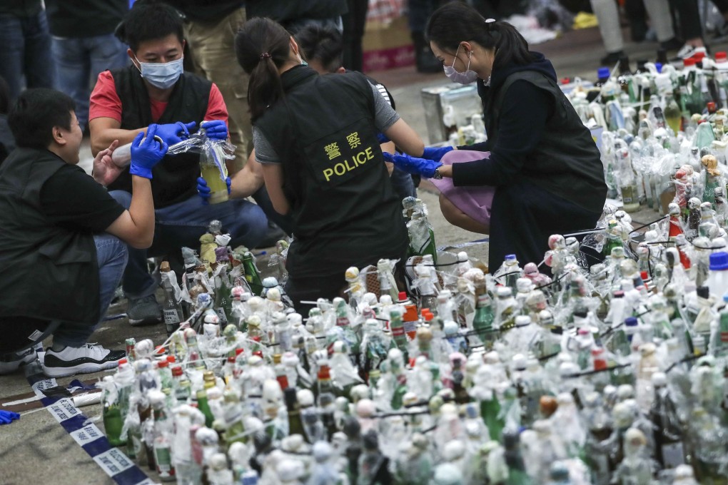 Police and firefighters collect evidence inside PolyU. Photo: Sam Tsang
