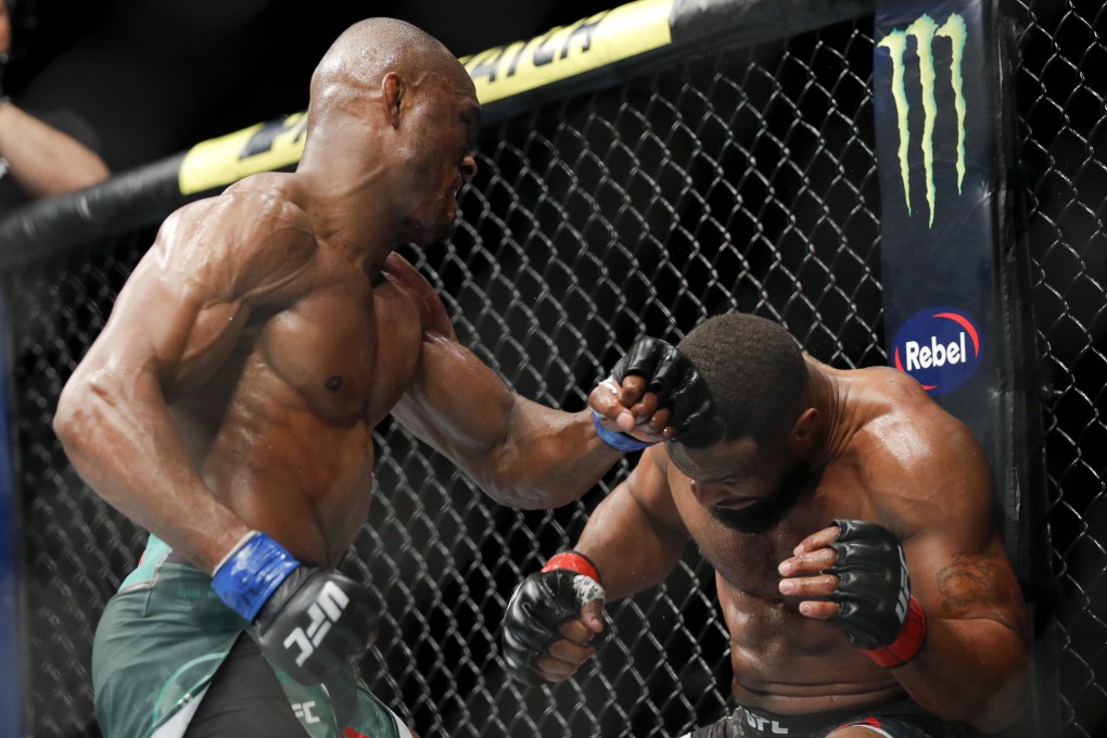 Kamaru Usman hits Tyron Woodley on his way to winning the UFC welterweight title at UFC 235. Photo: AP