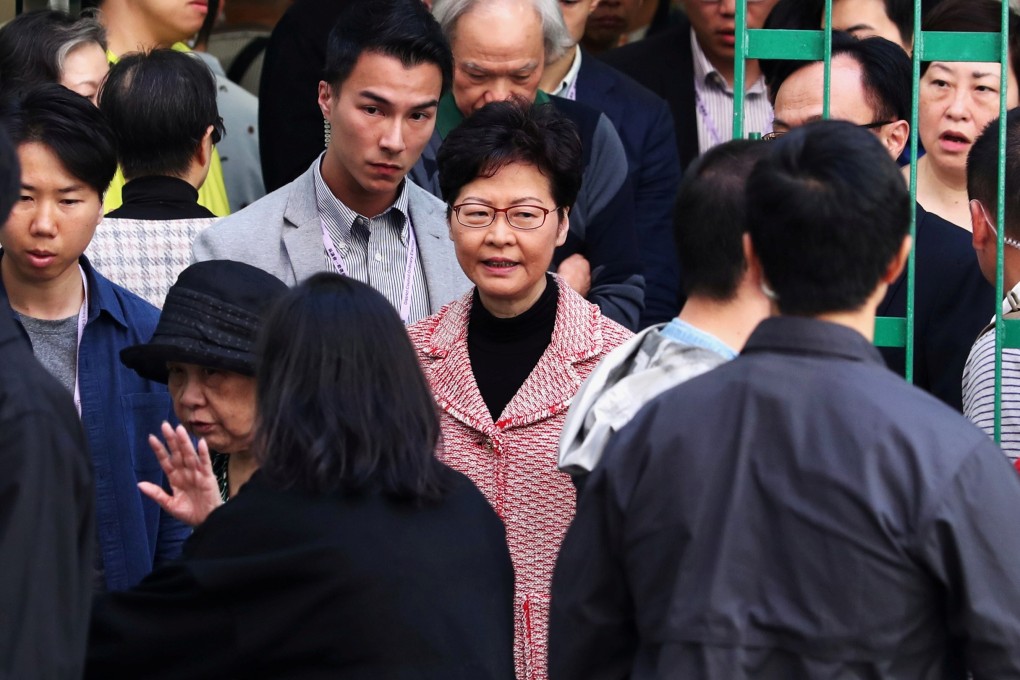 Hong Kong Chief Executive Carrie Lam leaves after voting at a polling station during the district council elections on November 24. Photo: Reuters