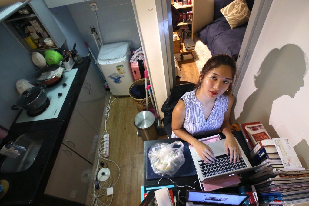 Sarah Wong, then a University of Hong Kong student from Macau, works on her computer in a flat in Sai Ying Pun in October 2017. Wong moved into the apartment with a classmate after she was denied accommodation in the university dorm in the second year of her studies. Photo: David Wong