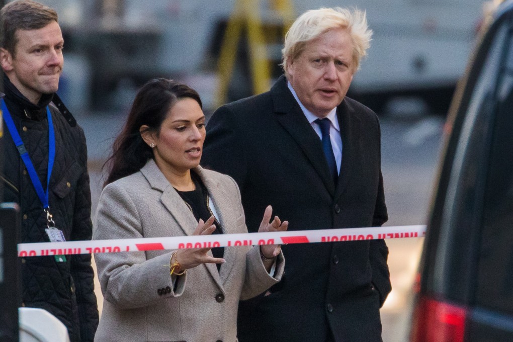 British Prime Minister Boris Johnson (R) and British Home Secretary, Priti Patel (C) visit the crime scene near London Bridge in London. Photo: EPA-EFE