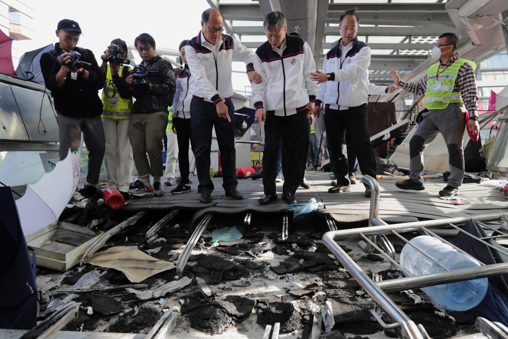 Professor Teng Jin-Guang (centre) and his team inspect the wrecked Polytechnic University campus. Photo: Edmond So