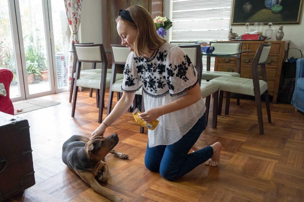 Sarah James with Holly at the family home in Sai Kung, Hong Kong. Photo: Gary Jones