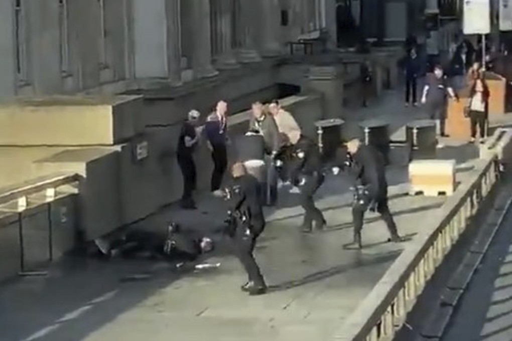 In this grab taken from video of the incident, the attacker is surrounded by armed police on London Bridge, in London. Photo: AP