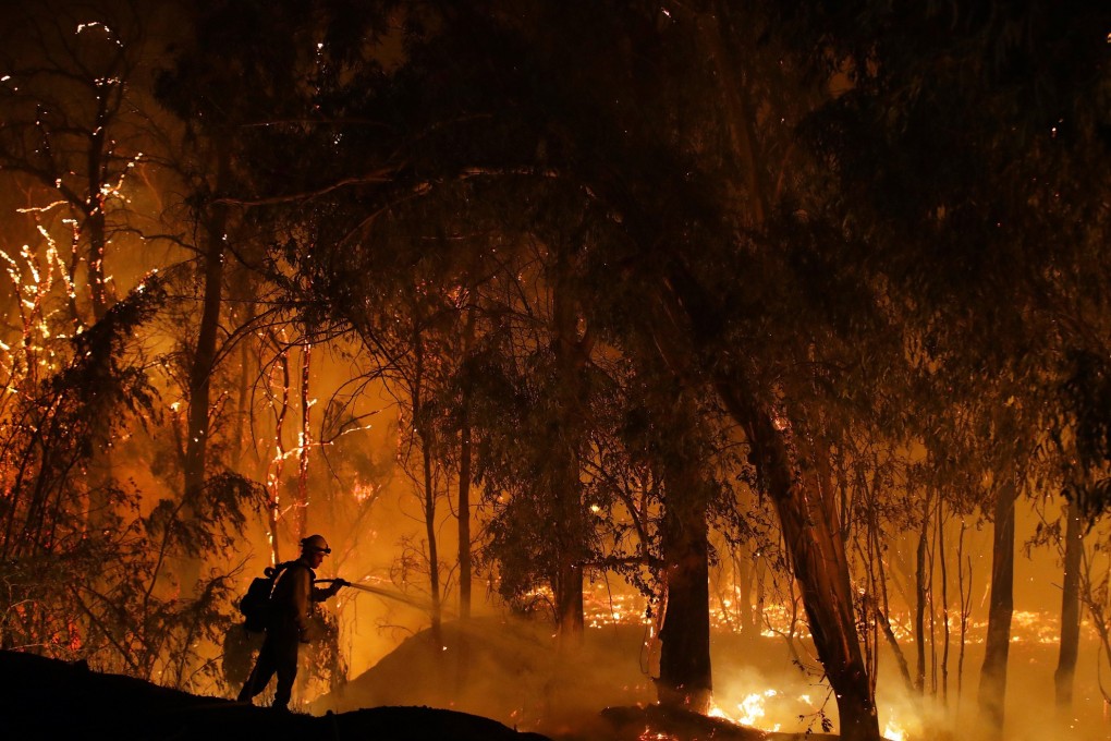 A firefighter battles a blaze in California. Photo: AP