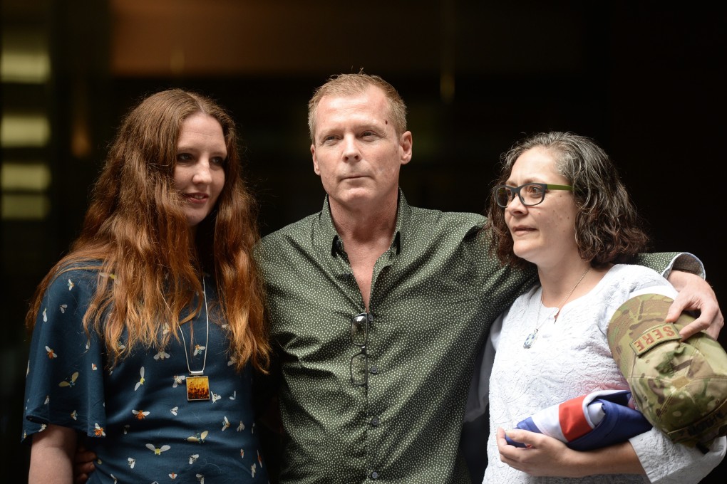 Australian academic Timothy Weeks with his sisters Alyssa Carter and Joanne Carter during a press conference in Sydney. Photo: EPA