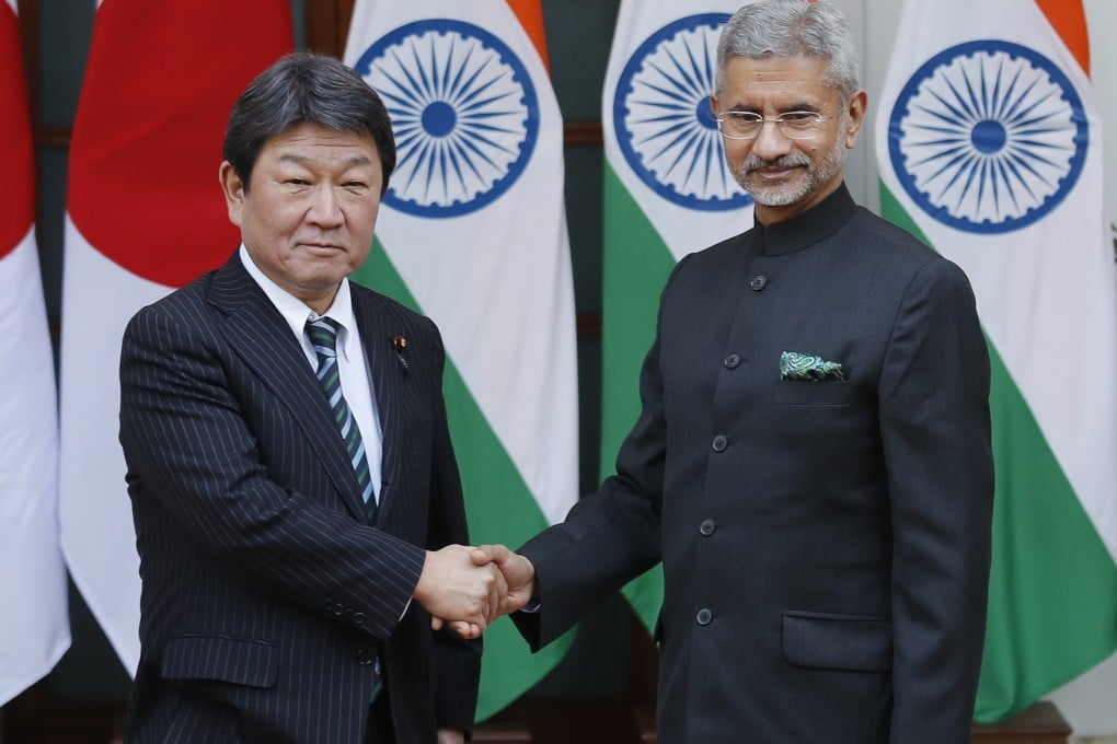 Japan’s Foreign Minister Toshimitsu Motegi shakes hands with Indian Foreign Minister S. Jaishankar before the start of India Japan 2+2 talks in New Delhi, India. Photo: AP