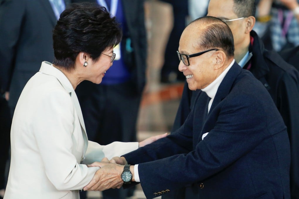 Li Ka-shing, one of the city’s most prominent tycoons, with current chief executive Carrie Lam during the 2017 vote. Photo: Reuters