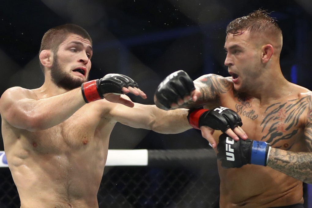 Dustin Poirier (right) gets UFC lightweight champion Khabib Nurmagomedov with a right hook during their title unification bout at UFC 242 in Abu Dhabi in September. Photo: AP