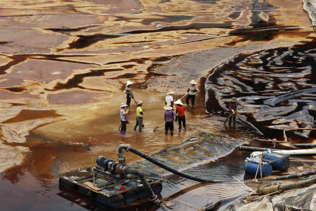 Workers near the Zijin copper mine in Shanghang in July 2010. Photo: AFP