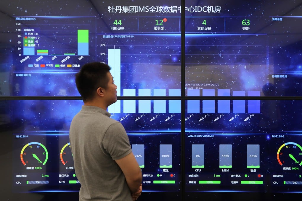 A man looks at the screen display at data Centre at Beijing Peony Electronic Group in May 2019. Photo: Simon Song