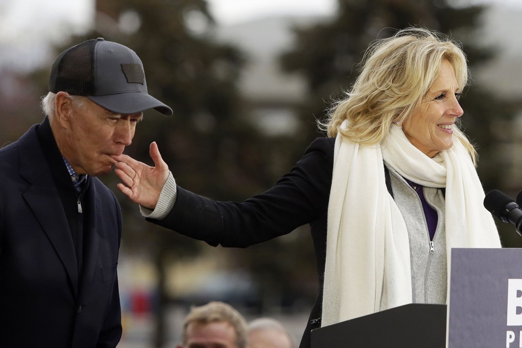 Democratic presidential candidate, former vice-president Joe Biden, bites the finger of his wife Jill Biden in Council Bluffs, Iowa. Photo: AFP