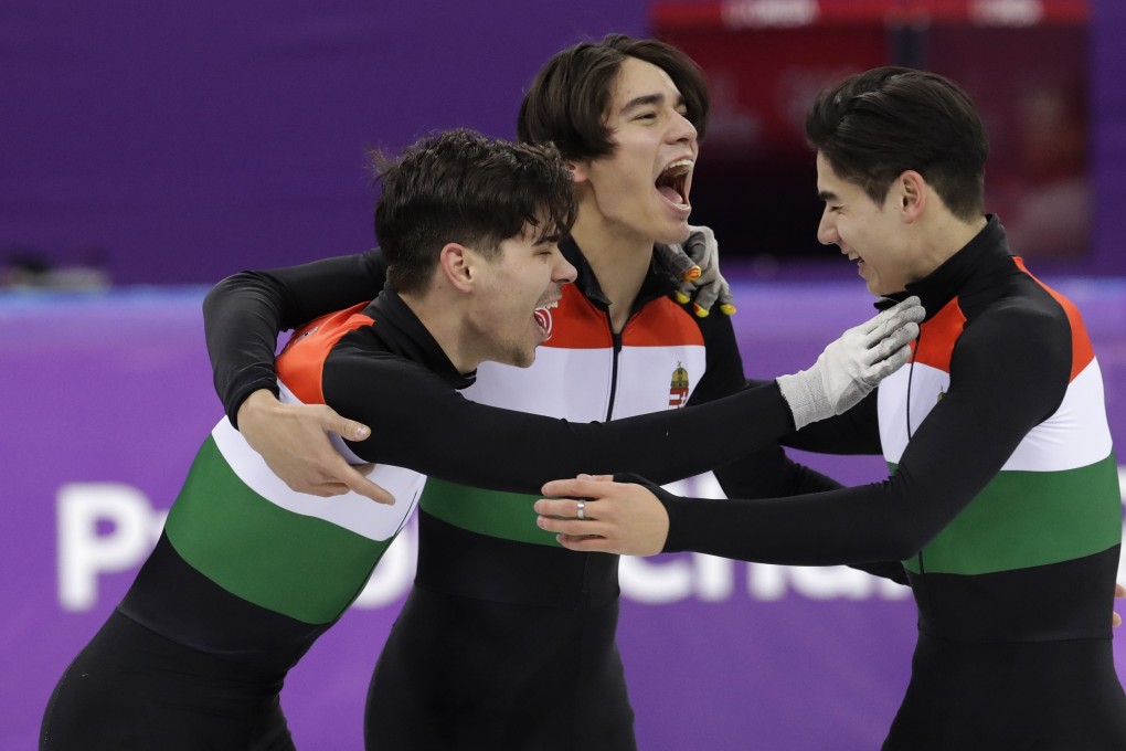 Csaba Burjan (left) celebrates with Hungary teammates after winning the men’s 5,000m short track event at the 2018 Winter Olympics. Photo: AP
