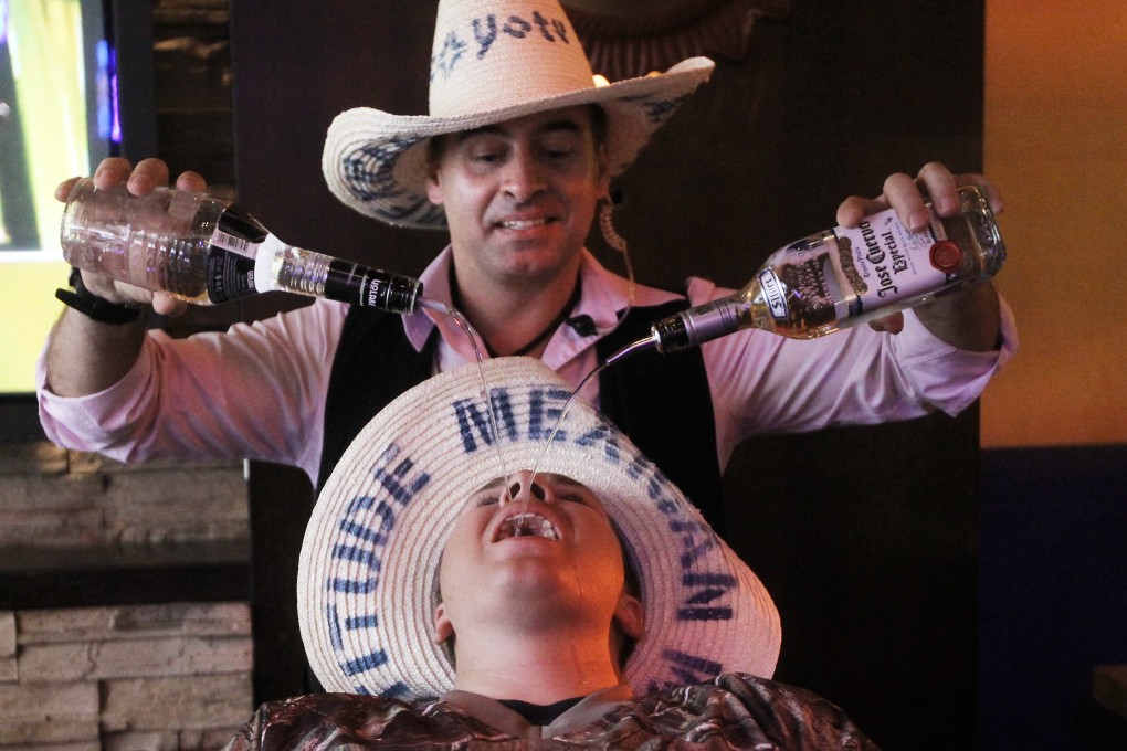 A US sailor enjoys his shore leave at a Hong Kong bar. Photo: Edward Wong.