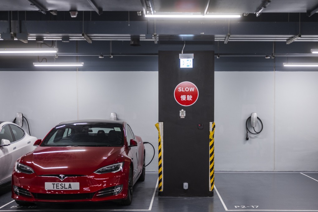 An electric vehicle gets charged at a facility in the Kowloon Bay in November 2018. Photo: Bloomberg