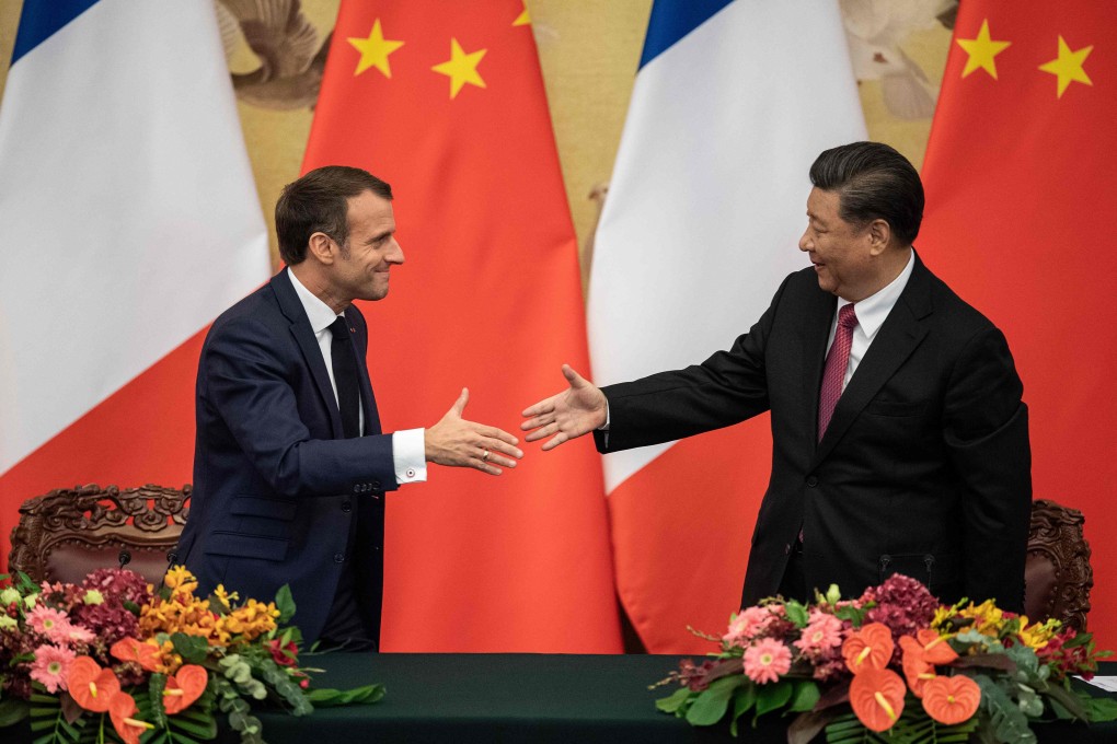 French President Emmanuel Macron shakes hands with Chinese President Xi Jinping following a signing ceremony at the Great Hall of the People in Beijing on November 6. Photo: AFP