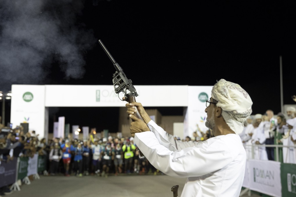 The starter fires the gun for the 2019 Oman by UTMB race. Photo: Lloyd Images/Mark Lloyd