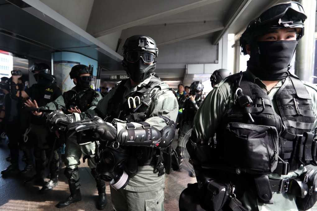Anti-riot police on patrol in Central keeping watch on an anti-government protest. Photo: Xiaomei Chen